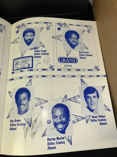 Signed Dallas Cowboys alumni page featuring Tony Dorsett and other legends