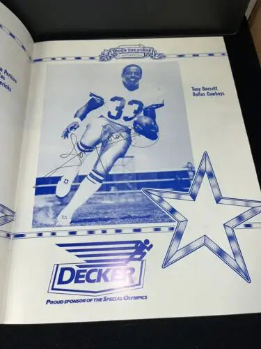 Autographed Tony Dorsett poster from 1985 Dallas Cowboys Touch the Stars program