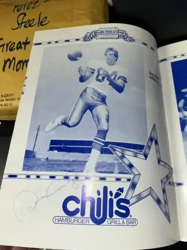Chili’s Hamburger Grill and Bar ad featuring Dallas Cowboys icons Tony Dorsett and Staubach