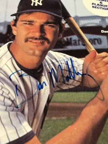 Autographed portrait of Don Mattingly in 1985 Yankees Media Guide with JSA authentication