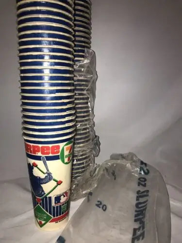 Stacks of baseball-themed paper cups with Rickey Henderson trading cards design