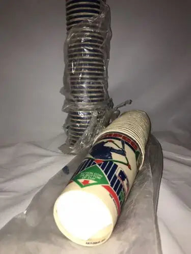Stacks of disposable cups showcasing the 1985 Original Unused 7-11 Slurpee Cup with Baseball Cards