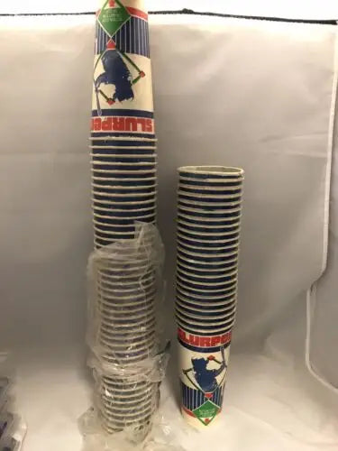 Stacks of baseball-themed paper cups featuring Rickey Henderson trading cards
