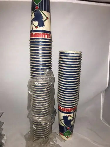 Stacks of vintage Slurpee cups with 1985 Original unused design featuring Rickey Henderson
