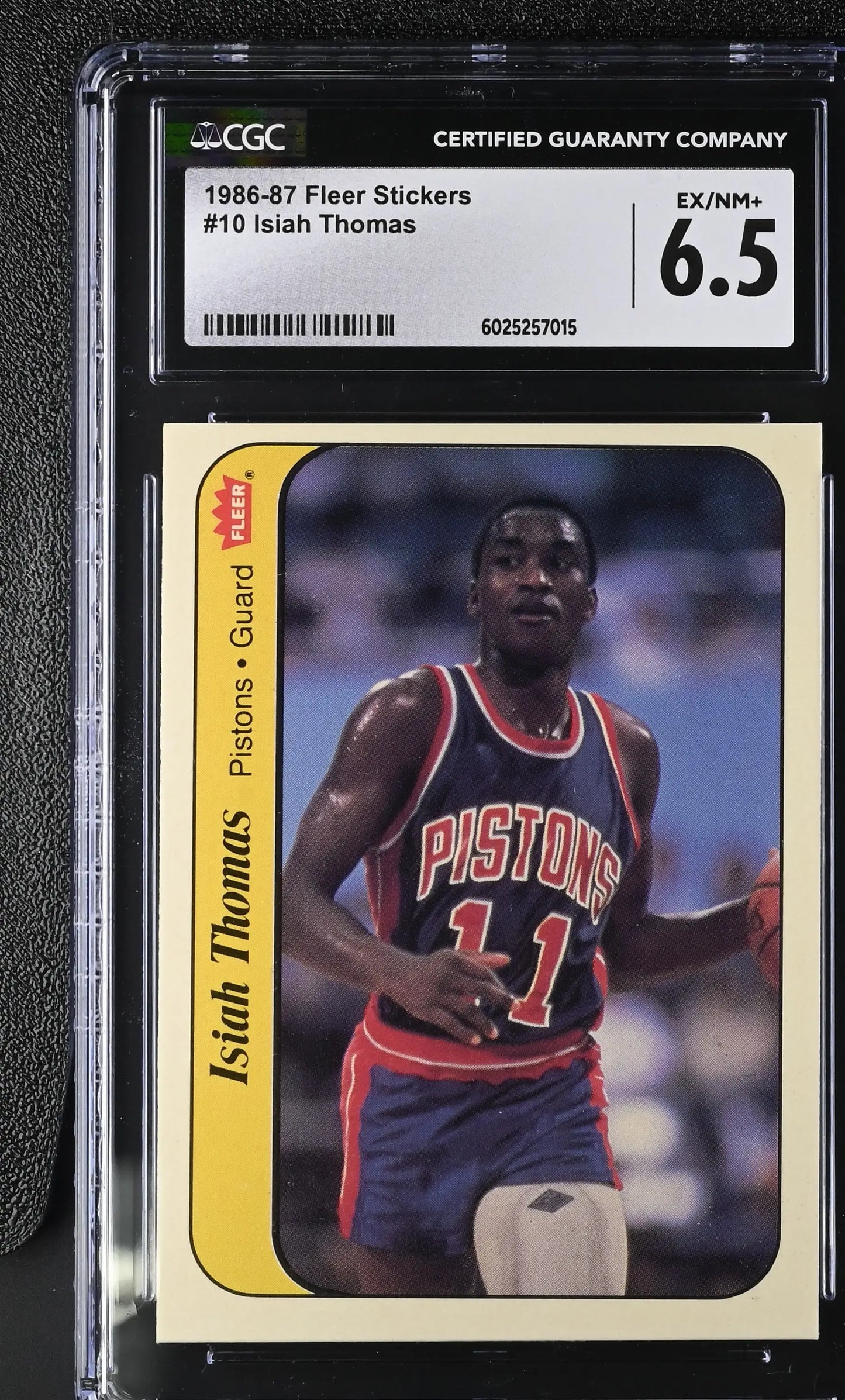 Graded 1986-87 Fleer Isiah Thomas basketball card featuring Detroit Pistons icon in excellent condition