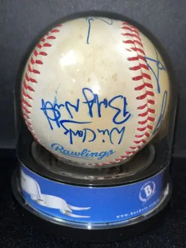Autographed baseball in display case featuring MLB Rookies key signatures and BAS certification