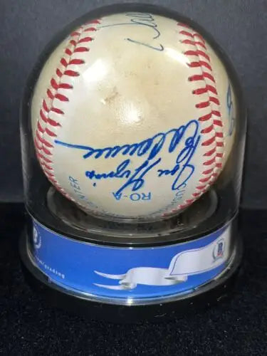 Signed baseball in display case featuring 1986 MLB Rookies and trading cards collectibles