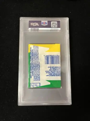 Graded 1986 Topps Football Wax Pack featuring Jerry Rice and Reggie White trading cards