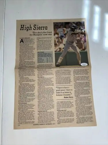 Folded newspaper article featuring 1987 Ruben Sierra signed JSA certified auto page