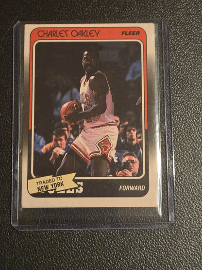 Vintage Charles Oakley Fleer basketball card featuring Chicago Bulls with traded to New York banner