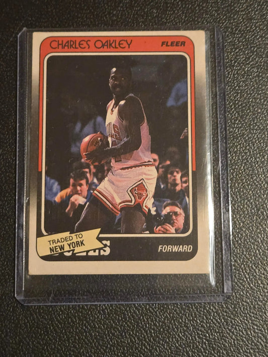 Vintage Charles Oakley Fleer basketball card featuring Chicago Bulls with traded to New York banner