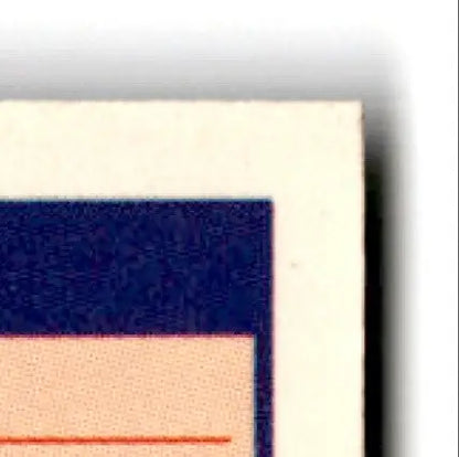 Vintage corner of a paper card with blue border featuring football Jerry Rice design