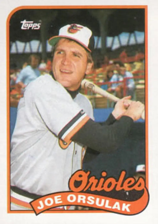 Vintage Topps baseball card of Joe Orsulak in white Orioles uniform holding bat