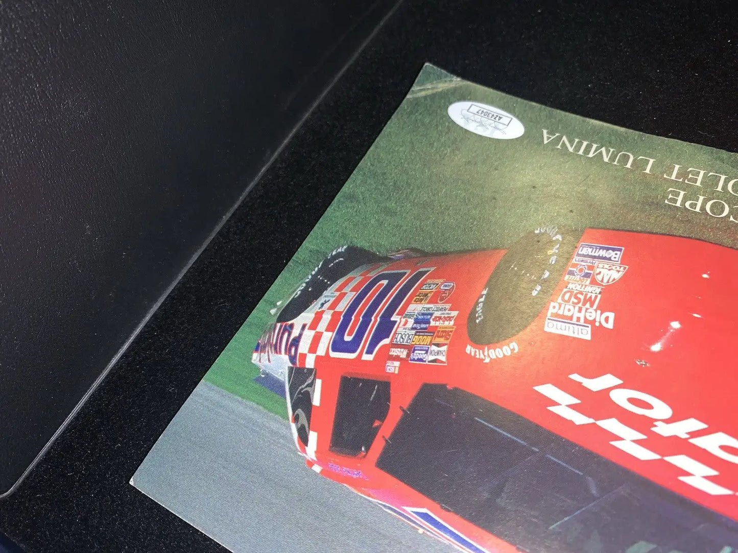 Red race car photograph of a 1991 Derrike Cope Purolator Chevrolet Lumina promo auto