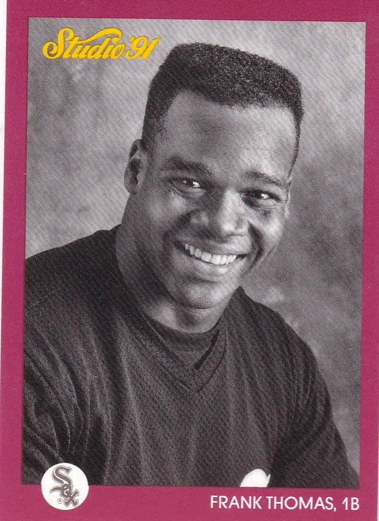Smiling young man in black sweater showcasing Leaf Studio Frank Thomas #40 White Sox card