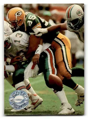 Football players in action on a 1991 Pro Set Platinum Bryce Paup Green Bay card
