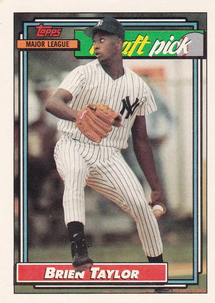 Baseball card of Topps Brien Taylor in Yankees pinstriped uniform mid-throw