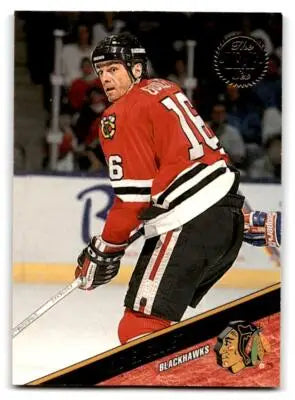 Hockey player in Chicago Blackhawks uniform featuring Michel Goulet from 1993-94 Leaf #373