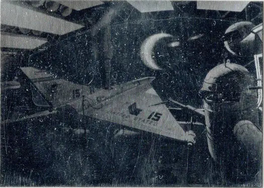 Military aircraft with folded wings on a carrier deck featured in a Holographic Card