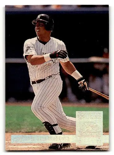 Original gloss baseball card of Andres Galarraga Colorado Rockies player swinging bat