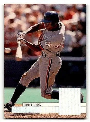Original gloss baseball card of Delino DeShields Los Angeles Dodgers player swinging bat