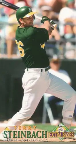 Baseball player swinging bat in green and white uniform on 1994 Fleer Extra Bases card