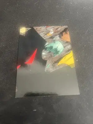 Damaged reflective surface with colorful abstract design on ShadowHawk Card Set special trading card