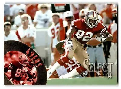 Football player in action featured on 1994 Select trading card of John Taylor