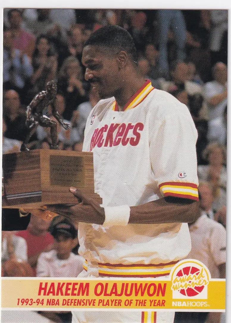 1994 SKYBOX #261 HAKEEM OLAJUWON DEFENSIVE PLAYER OF THE YEAR- HOUSTON ROCKETS - Basketball Card Single