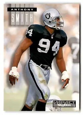 Football player Anthony Smith in Raiders uniform from 1994 SkyBox Impact trading cards