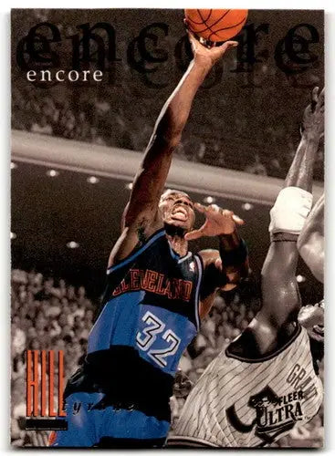 Basketball player in action from Fleer Ultra Tyrone Hill 1995-96 original gloss card