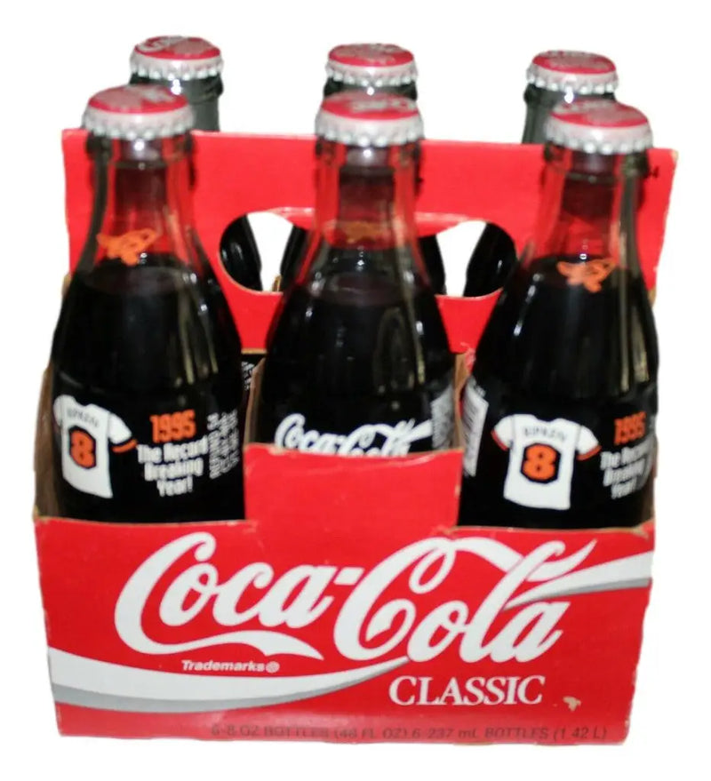 Six-pack of Coca-Cola Classic bottles in a commemorative carrier for record breaking year