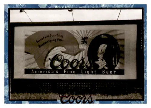 Original gloss Coors beer advertisement on arrow billboard near Mint by Simply Sandoval