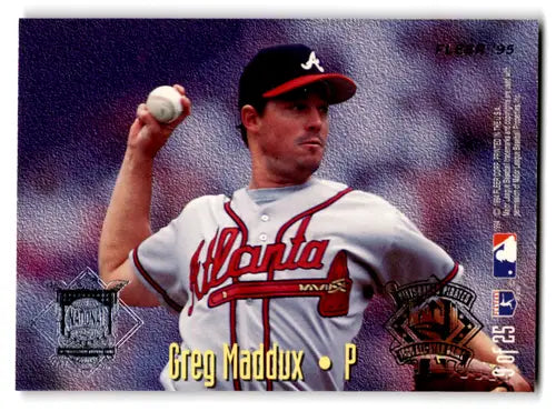 1995 Fleer baseball card featuring Greg Maddux as a pitcher for the Atlanta Braves