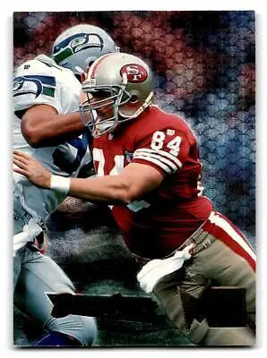 Football player in action on 1995 Fleer Metal #173 Brent Jones trading card