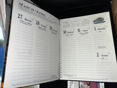 Open spiral-bound calendar featuring Jeff Bagwell MVP signed items for Houston Astros fans