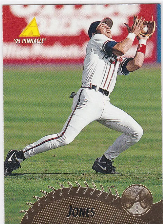 Chipper Jones Atlanta Braves player in white uniform catching a fly ball