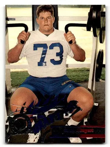 Original gloss of 1995 Stadium Club D438 Zach Wiegert St. Louis Rams football card showing young player in white jersey on weight machine