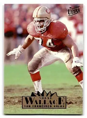 Steve Wallace in red San Francisco 49ers uniform, defensive stance, trading card image