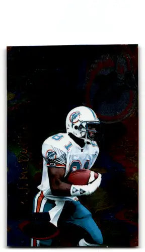Football player in action from 1996 Playoff Illusions O J McDuffie with original gloss