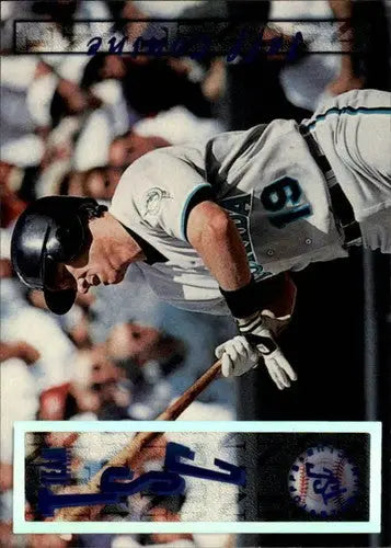 Baseball player swinging bat during game in stadium club Jeff Conine original gloss card
