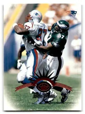 Football action scene featuring Ben Coates on the 1997 Leaf trading card