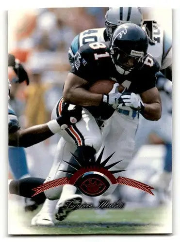 Football player in action from 1997 Leaf Terance Mathis Atlanta Falcons football card
