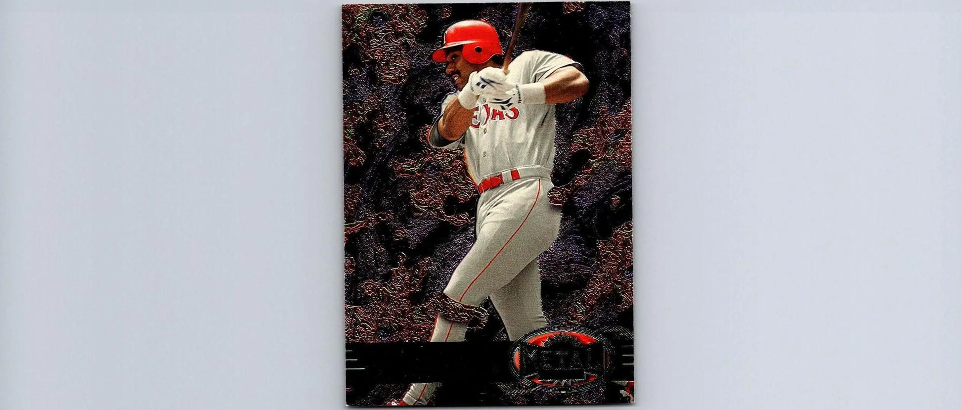 Baseball card featuring Juan Gonzalez from 1997 Metal Universe trading cards