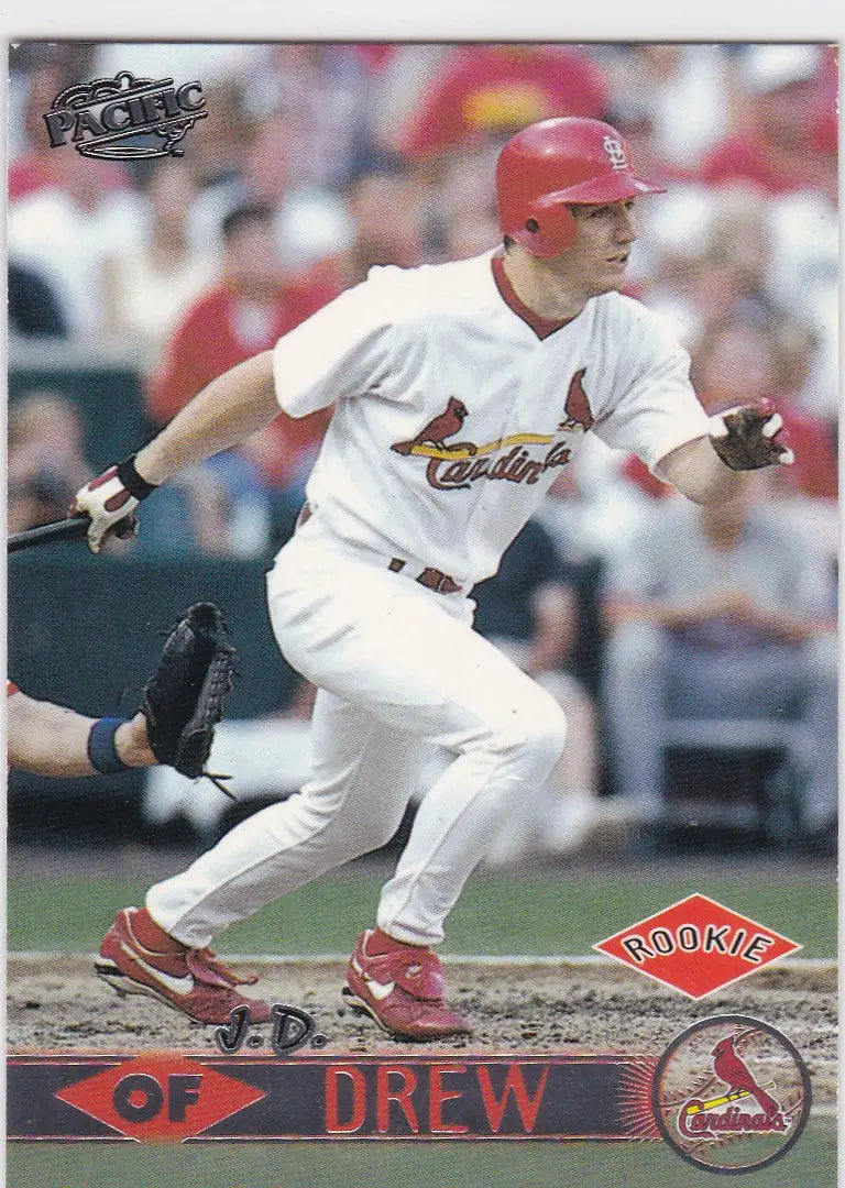 Baseball player in white Cardinals uniform swinging bat for Louis Cardinals trading cards