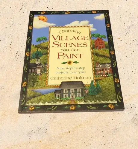 Painting instruction book showing village scenes from 1999 Village Scenes You Can Paint by Catherine Holman on store shelf pulls