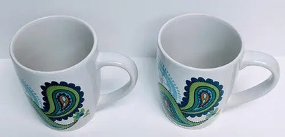 Two white ceramic mugs with Norfolk Blue Green and Blue Green Teal paisley patterns