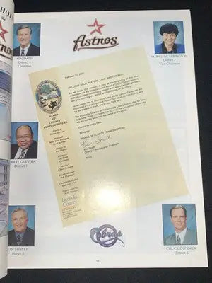 Printed Houston Astros deck magazine page with official letter, portraits, and team logos