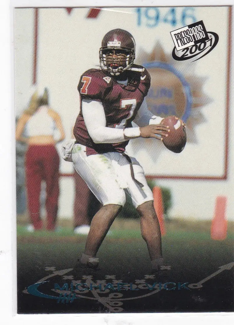 Football player in maroon jersey preparing to throw pass from 2001 Press Pass Checklist Michael Vick Virginia Tech
