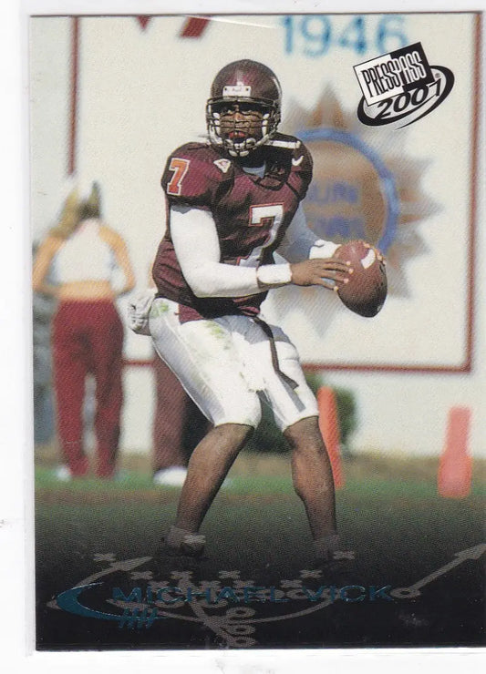 Football player in maroon jersey preparing to throw pass from 2001 Press Pass Checklist Michael Vick Virginia Tech